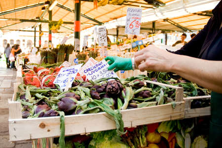 italian costermonger selling greenstuff at the marketのeditorial素材