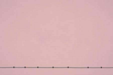 Textured pink background with gridの写真素材