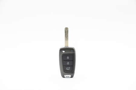 Electronic car key with buttons for remote opening and unlocking isolated on white background.