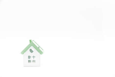Small conceptual house isolated on white background with plenty of copy space.の写真素材