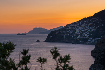 Amalfi Coast, Italy. After sunset, the coastline viewed from Conca dei Marini. On the right the small town of Praiano and the Island of Capri at the horizon.の写真素材
