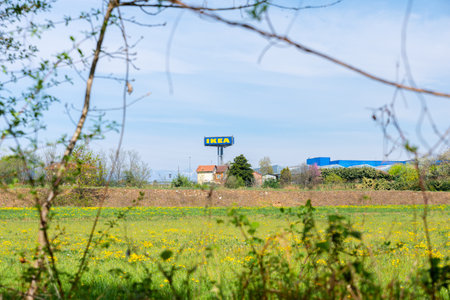 Collegno, Italy. April 5th, 2021. Sign of an IKEA store in Collegno near Turin, seen from a filed of the Dora Riparia park.のeditorial素材