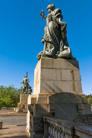 Turin, Italy, May 12th, 2021. Bronze statue representing the Majesty who protects the Art located near the ancient Umberto I Bridge, Corso Moncalieri side.のeditorial素材