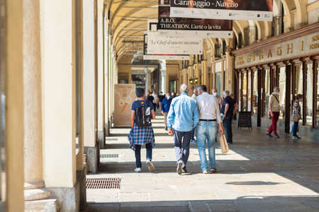 Turin, Italy. June 10, 2021. View of the shops and people strolling along the arcades of Via dell'Arcivescovado in the center of the city.のeditorial素材