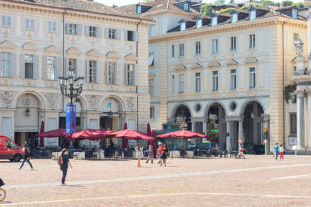 Turin, Italy. June 10, 2021. View of historic buildings and a cafÃ© in Piazza San Carlo with people and tourists.のeditorial素材