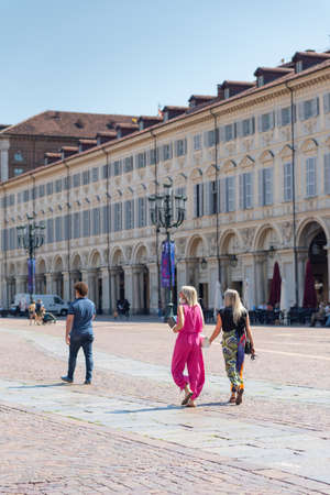 Turin, Italy. June 10, 2021. View of Piazza San Carlo in the morning on a sunny day with people walking in the square.のeditorial素材