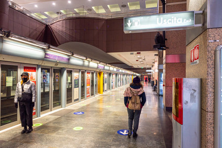 Turin, Italy. December 13th, 2020. People waiting for the subway train at the Porta Nuova stop.のeditorial素材