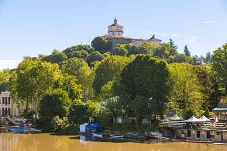 Turin, Italy, May 12th, 2021. View from Ponte Umberto I over the river Po and the Monte dei Cappuccini hill with the Church and Convent of Santa Maria al Monte on the top.のeditorial素材