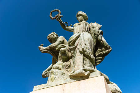 Turin, Italy, May 12th, 2021. Bronze statue representing the Majesty who protects the Art located near the ancient Umberto I Bridge, Corso Moncalieri side.のeditorial素材