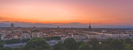 Turin, Italy. Panoramic view of the city in the evening after sunset. Skyline with the Mole in the evening. Banner Header Horizontal. July 1, 2022.のeditorial素材