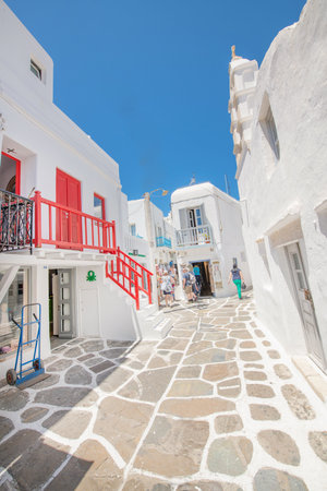 Tourists walk in the narrow streets of Oia.の写真素材
