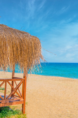 Beautiful tropical beach and sea with umbrella and chairの写真素材