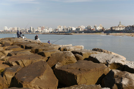 Fishermen fishing on the rocks in Mar del Plata, Buenos Aires, Argentinaのeditorial素材