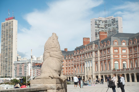 Sea lion statue in Mar del Plata Boulevard Tourists walkingのeditorial素材