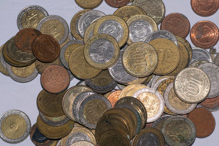 A handful of coins from Argentina, on the table