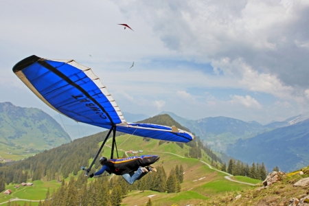 SANTS, SWITZERLAND - May 27: Competitor  Ievgen Lysenko from Ukraine of the Swiss Masters hang gliding competitions takes part on May 27, 2012 in Sants, Switzerland のeditorial素材