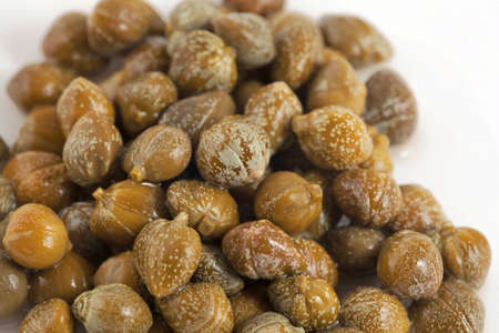 Green and appetizing capers. To be used as background.