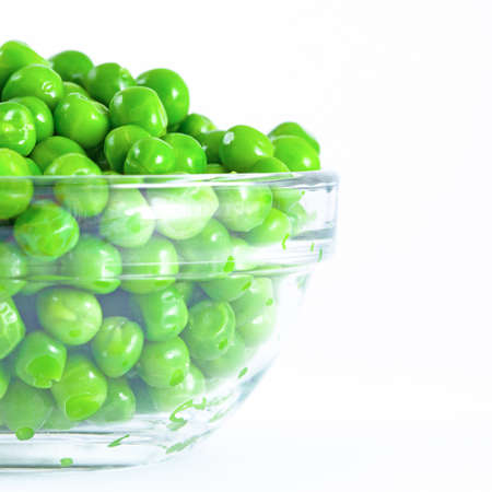 Green pea in glass plate, isolatedの写真素材