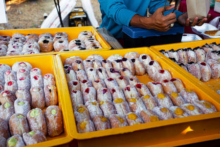 Fresh sugar donuts assortmant in night market in Malaysiaの写真素材