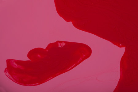 abstract background with pink and red nail polishの写真素材