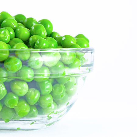 Green pea in glass plate, isolatedの写真素材
