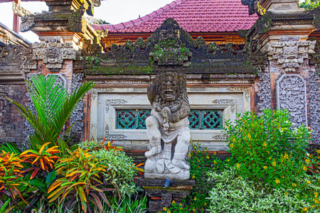 Traditional stone statues depicting demons, gods and Balinese mythological deities in Bali, Indonesiaのeditorial素材
