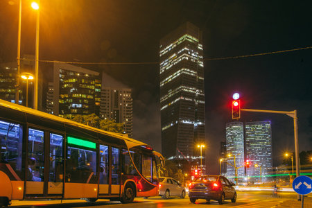 Tel Aviv At Night, Skyscraper Construction Sites and traffic In Tel avivのeditorial素材