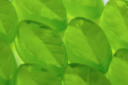 Green leaf form jelly candies background