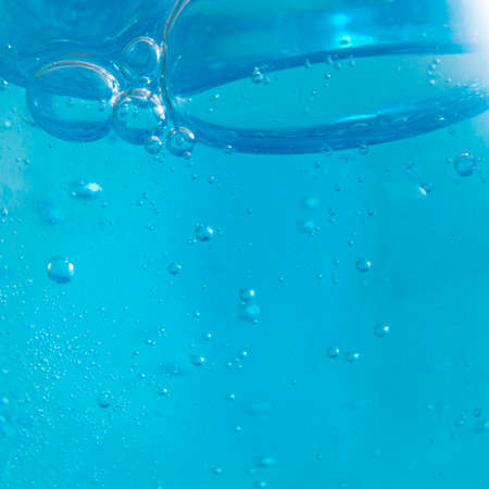 Shampoo closeup - Bubbles on blue background