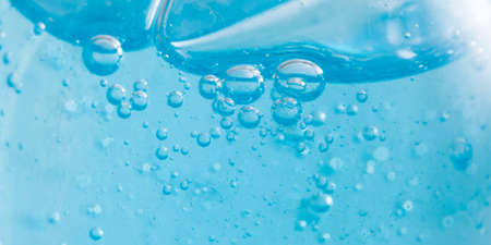 Shampoo closeup - Bubbles on blue background