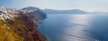Beautiful view of famous romantic white town in Santorini Island, Greeceの写真素材