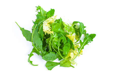 Fresh salad, lettuce and rukkola leafes isolated on white