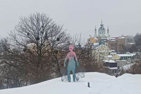 Kiev, Ukraine - Februrary 10, 2021: Statue of gathering garbage in the city concept, v iew of the Kyiv downtown, "Andriyivskyi Uzviz" street, in snowy winter weatherのeditorial素材