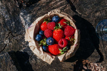 Fresh berries on wooden backgroundの写真素材