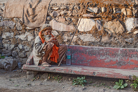 Rishikesh, Uttarakhand / India - December 1, 2019: Indian hindu devotee monks (sadhu) around famous Swarg Ashram in pilgrimage tourist spot Rishikeshのeditorial素材