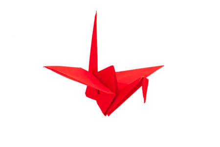 Red origami crane isolated on whiteの写真素材
