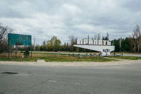 Pripyat, Ukraine - APRIL 15, 2019: sign welcoming visitors of Chernobyl city, Dead city Pripyat. Chernobyl now touristic attraction in popular Chernobyl tours (Translation of text in cyrilics: Pripyat)の写真素材