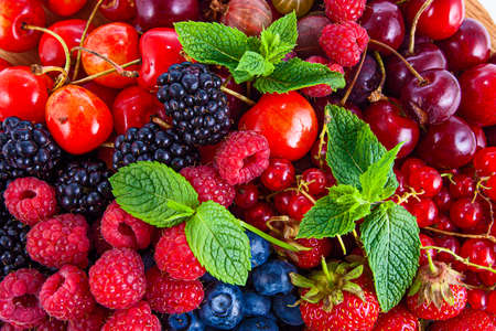 Fresh mixed summer berries - raspberry, strawberry, blueberryの写真素材