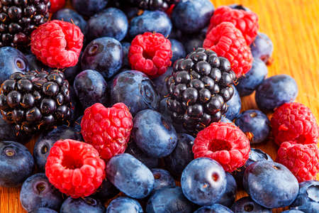 Fresh mixed summer berries - blueberry, raspberry and blackberryの写真素材