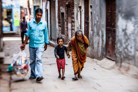 VARANASI, INDIA - NOVEMBER 2: Old woman in streets of Varanasi ion Diwaly holiday on November 7,2013 in Varanasi, India.のeditorial素材