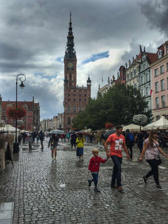 Gdansk, Poland- September 2, .2018: Tourists on the Long Lane of the old town in Gdansk, tower of Town Hall and main street on the old city center of Gdansk. Poland.のeditorial素材