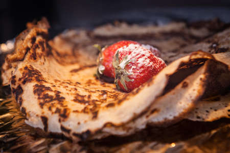 tack of wheat golden pancakes or pancake with strawberryの写真素材