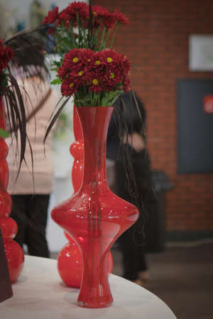 red flowers in vaseの写真素材