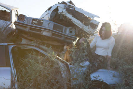 beautiful young girl poses near retro carの写真素材