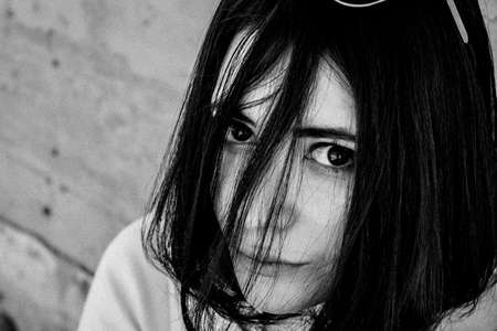 beautiful brunette woman with dark eyes portraitの写真素材