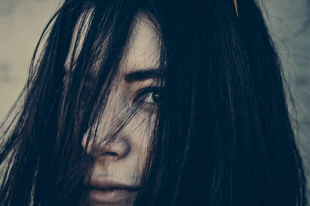 beautiful brunette woman with dark eyes portraitの写真素材