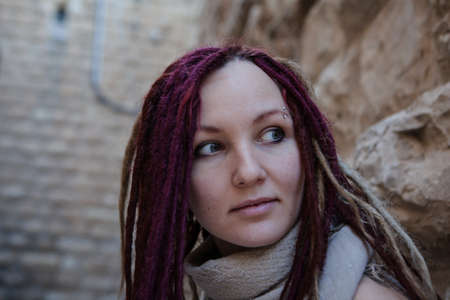 Portrait of a young woman with pink dreadlocks in Old Jerusalemの写真素材