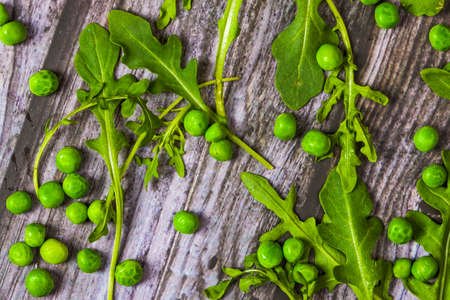 green peas and 
arugula on wooden backgroundの写真素材