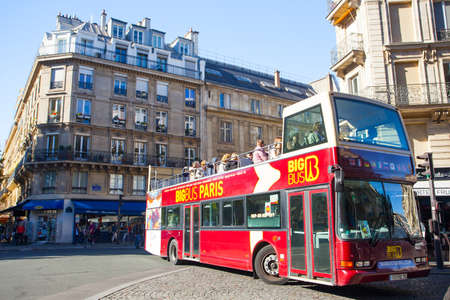 PARIS, FRANCE - OCTOBER 4, 2016 : Tourists bus in the heart of the capital of France. Paris is one...