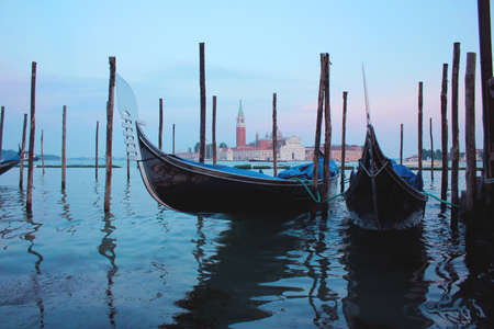 Venice Canal in summer with Gondola, Italyの写真素材